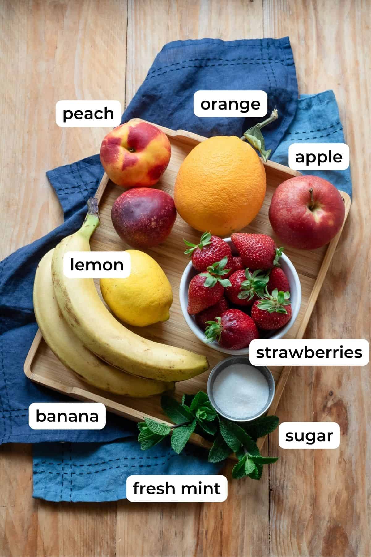 Italian fruit salad ingredients laid on a flat surface.