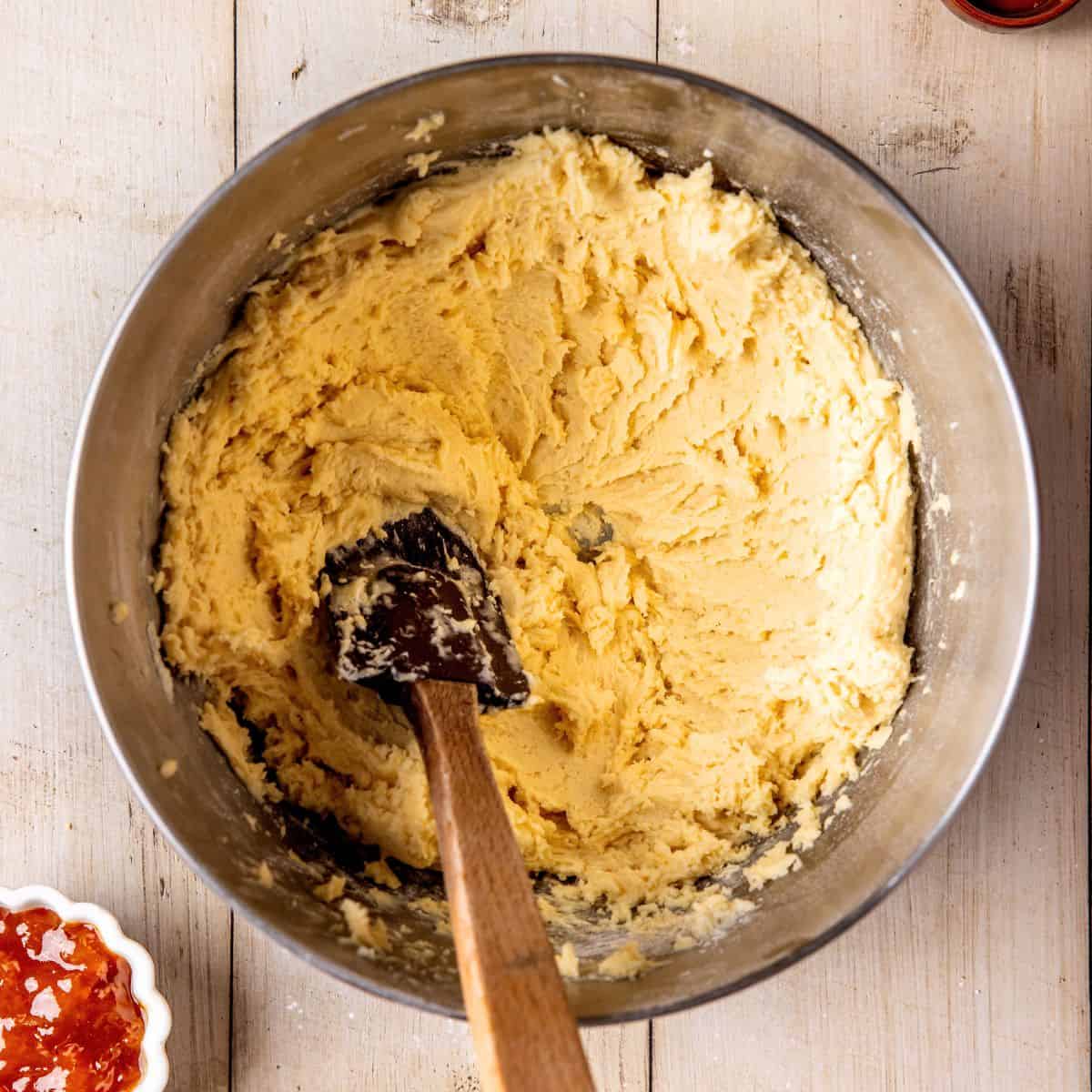 Mixing cookie batter with a spatula.