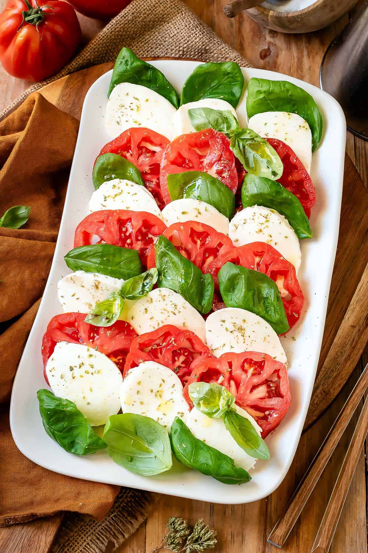 Caprese Salad on a white serving plate.