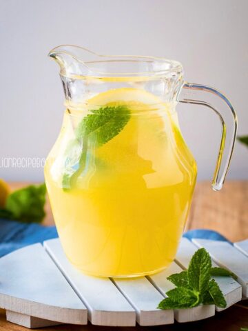 Italian Lemonade in a pitcher with mint leaves.