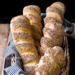 Semolina bread loaves in bread basket.