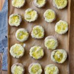 ricotta stuffed mushrooms on a baking sheet