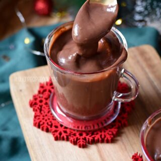 Thick hot chocolate on a spoon.