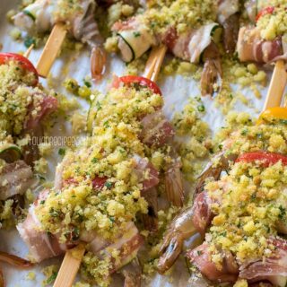 shrimp zucchini skewers on a baking sheet