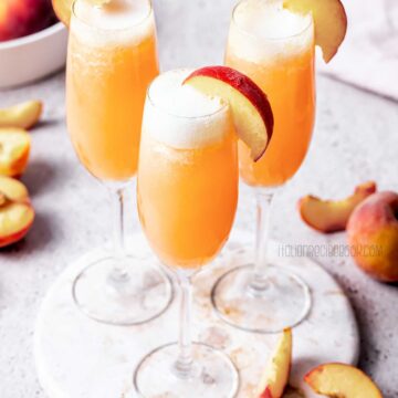 bellini cocktail in flute glasses