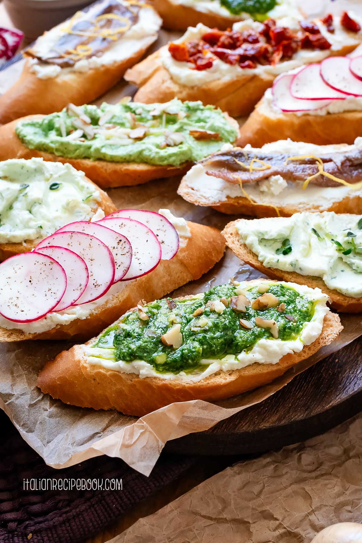 Whipped ricotta crostini on a platter.