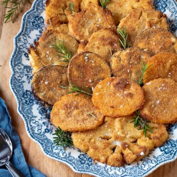 Oven-fried vegetables on an oval plate.