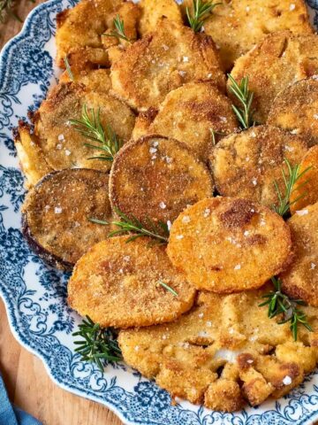 Breaded veggies on a serving dish.