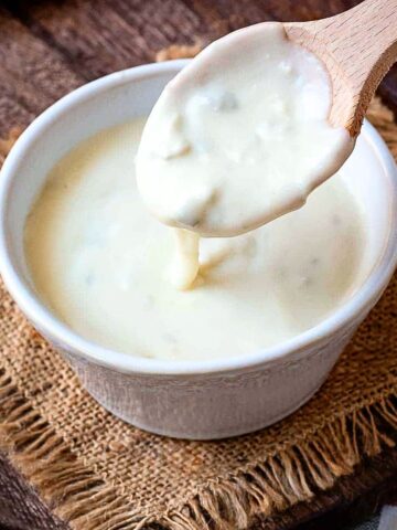 Gorgonzola Cream Sauce on a wooden spoon.
