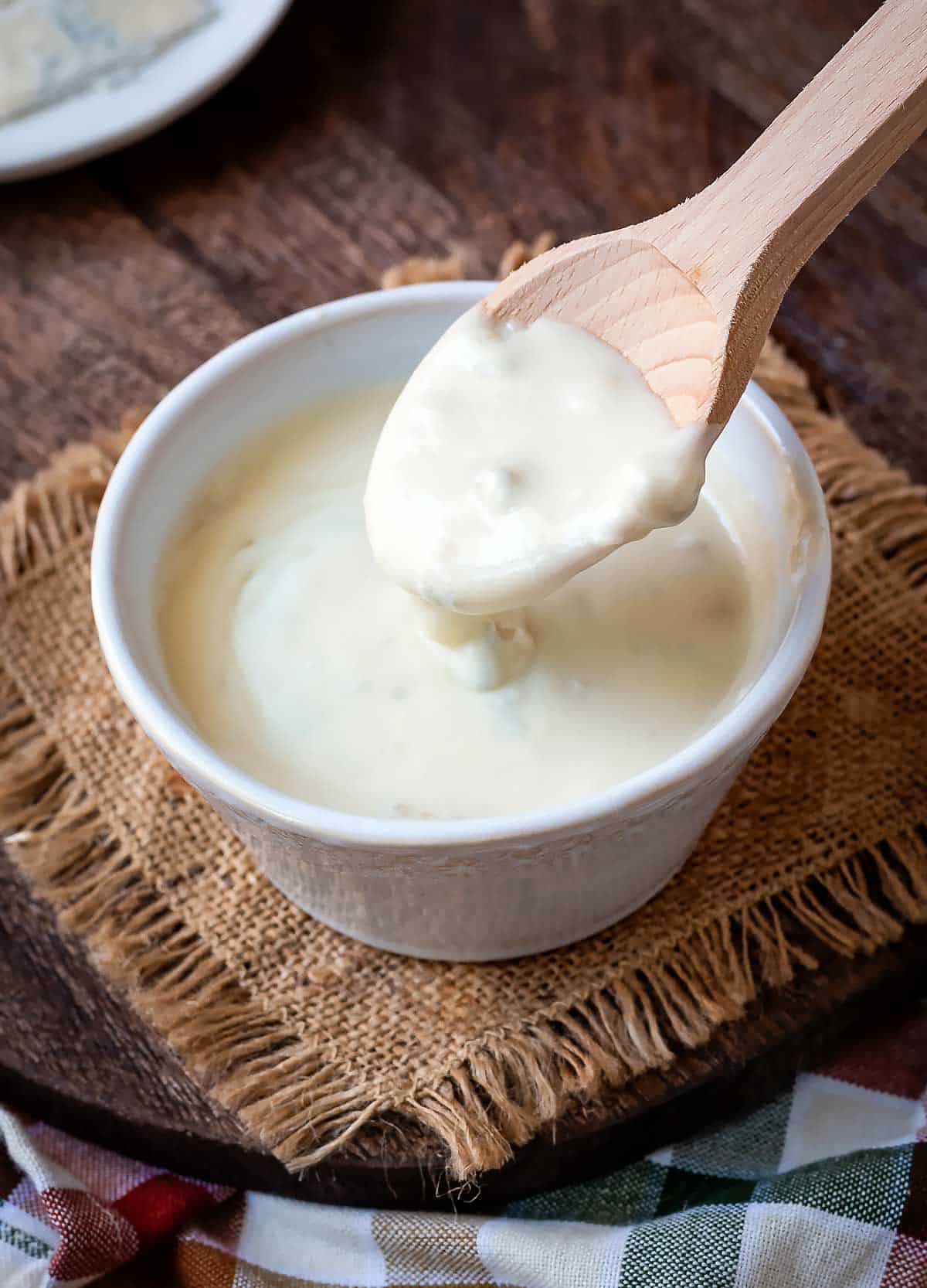 Sauce coating a wooden spoon.