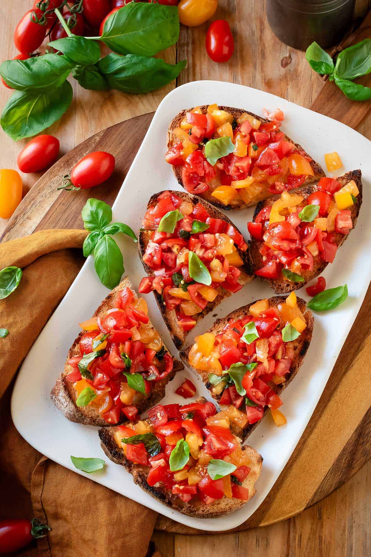 Cherry tomato bruschetta on a platter.