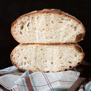 Pugliese bread loaf cut in half.