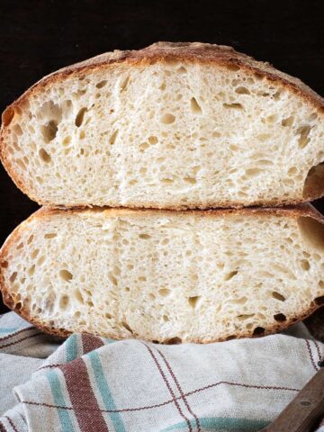 Pugliese bread loaf cut in half.