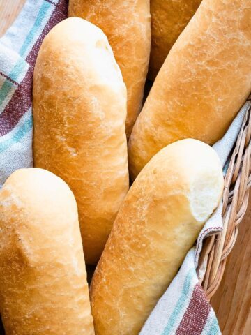 Panini bread rolls in a basket.