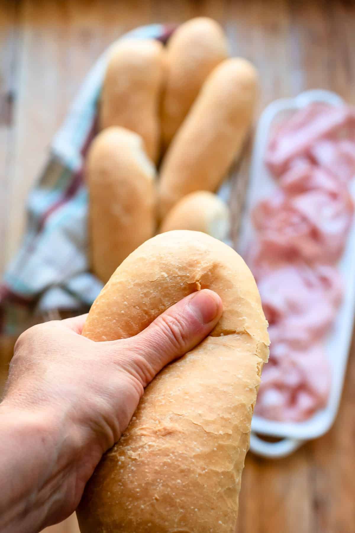 Squeezing extra soft panini bread.