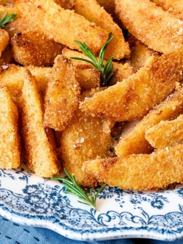 Parmesan potatoes on a serving plate.