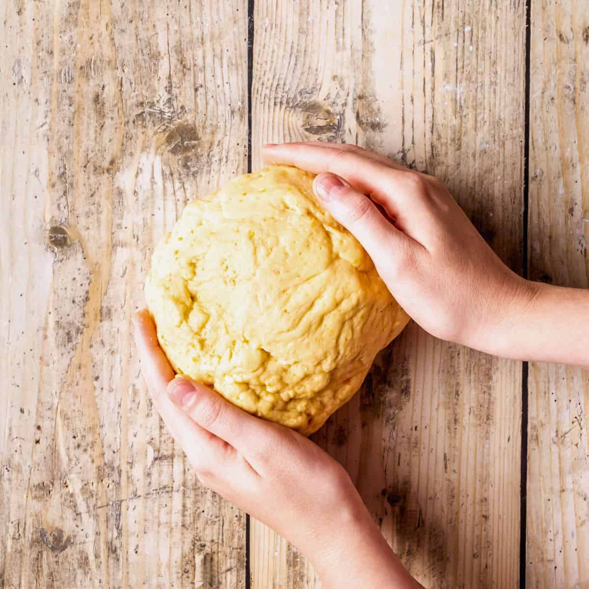 Kneading struffoli dough.