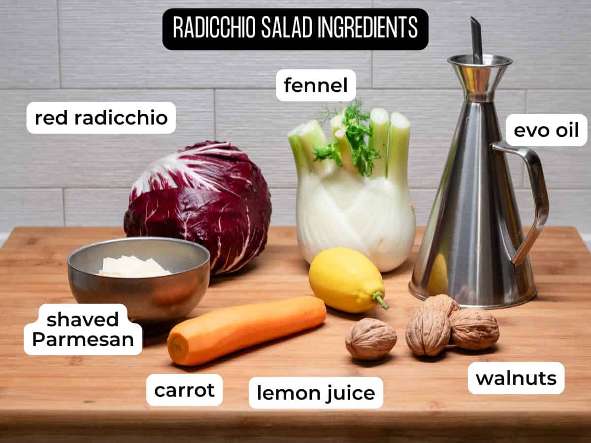 Radicchio salad ingredients laid on a wooden board.