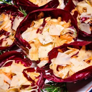 Radicchio salad cups topped with shaved Parmesan.